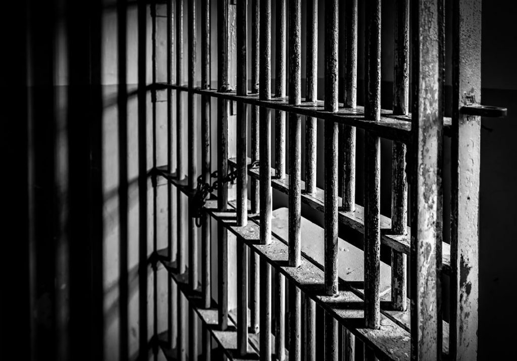Government defends use of prisons for immigration detainees