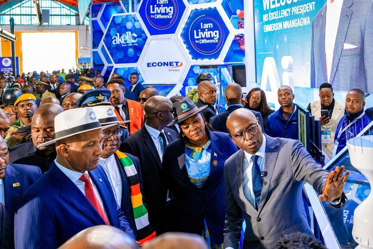 Econet Deputy CEO Mr Roy Chimanikire (right) makes a point at the Econet ZITF stand on Thursday as President Duma Boko of Botswana (left), President