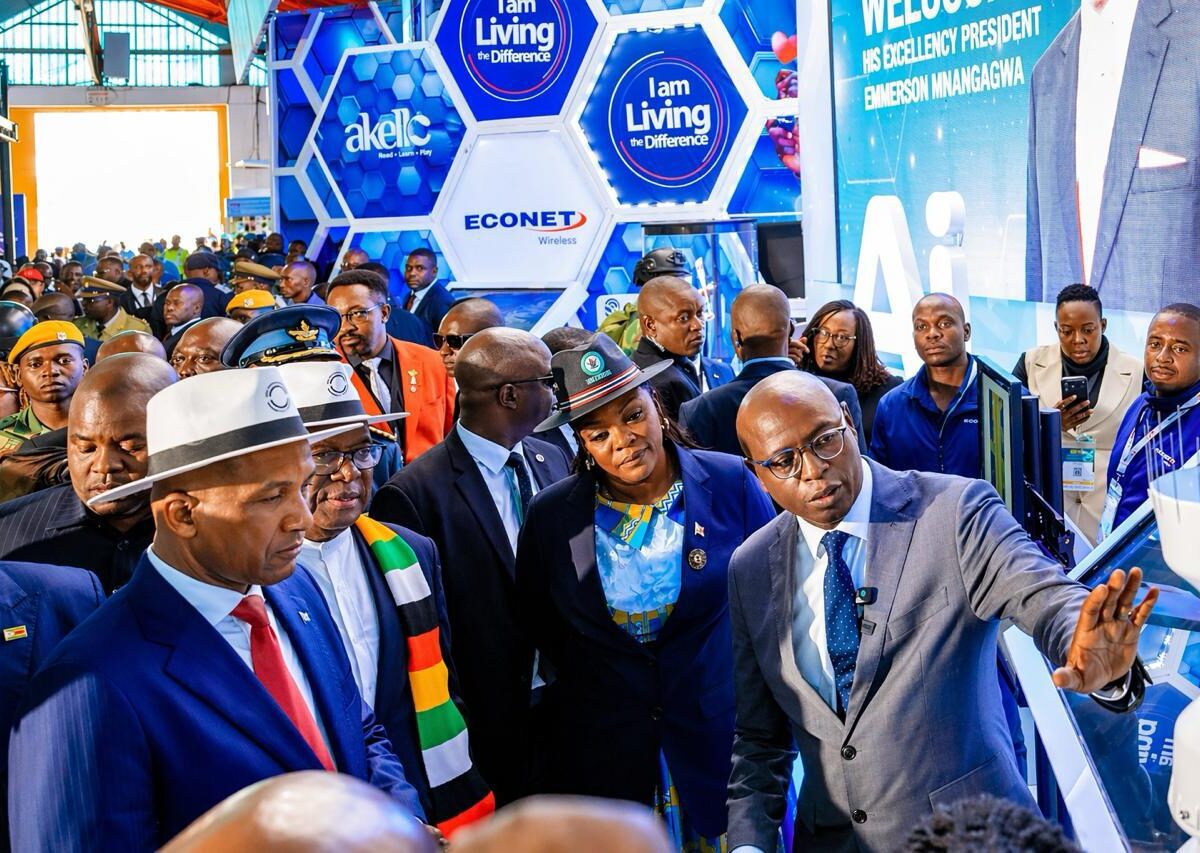 Econet Deputy CEO Mr Roy Chimanikire (right) makes a point at the Econet ZITF stand on Thursday as President Duma Boko of Botswana (left), President