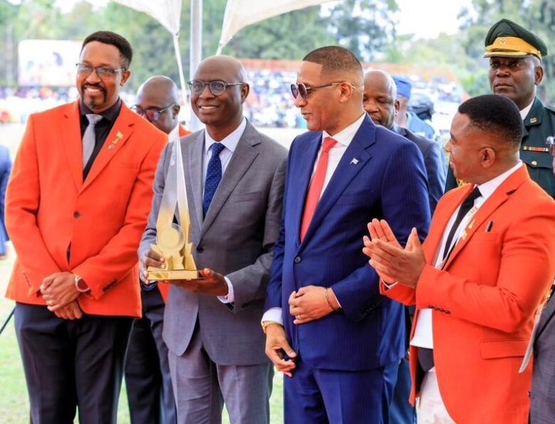 Econet Deputy CEO Roy Chimanikire (second from left) smiles as he receives the ZITF Supreme Stand Award 2026 from President Duma Boko (centre). Looking on is the Board Chairman of the ZITF company, Mr Busisa Moyo (left) and the CEO of the ZITF company Dr Nicholas Ndebele (right).
