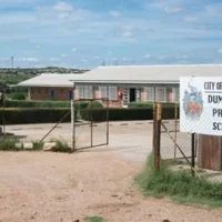 Parents seek answers over eight-year sewer delay at Dumezweni Primary
